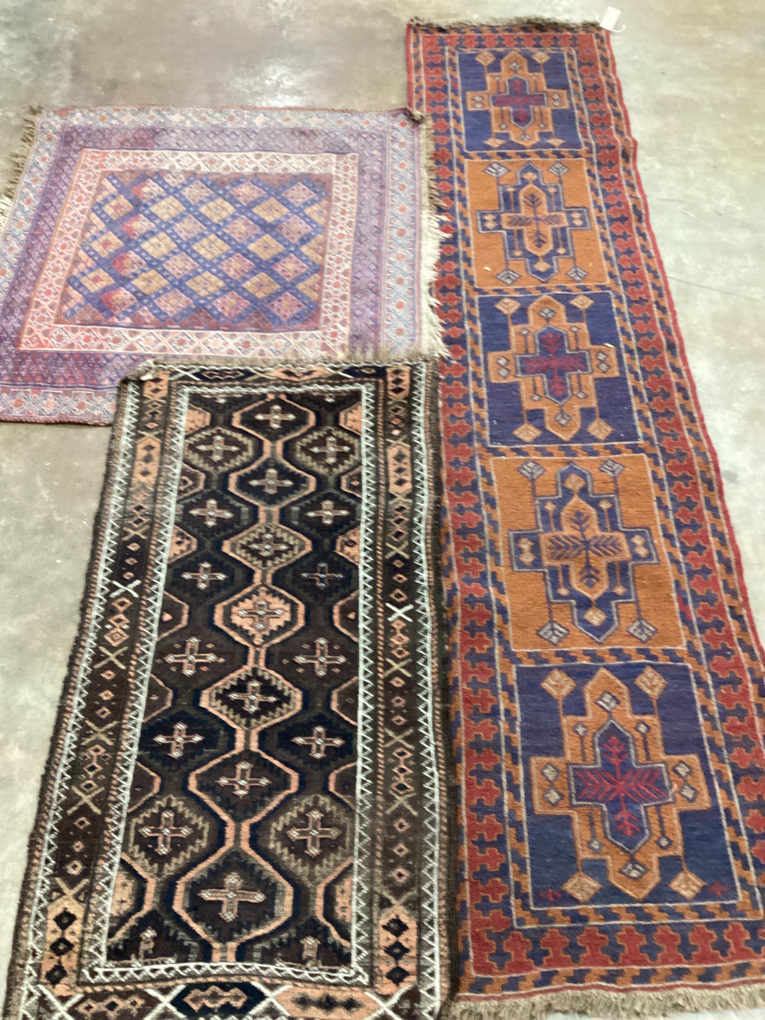 An Afghan runner, 250 x 58cm, a Belouch rug and one other rug (3)
